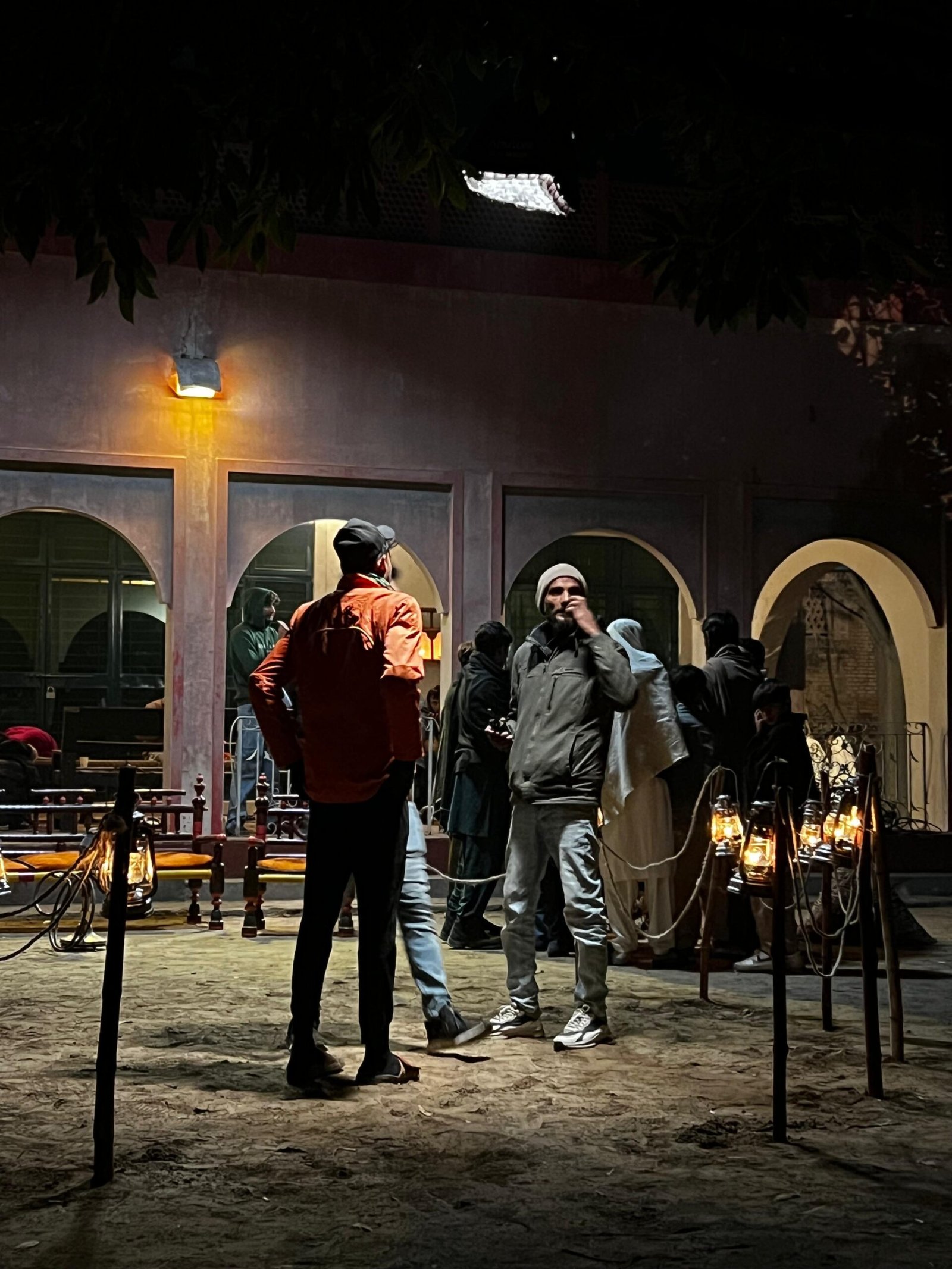 Crew between takes on the night set